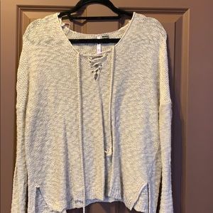 Long sleeve beige sweater.